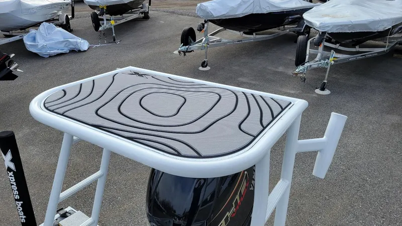 Slide: The Image of 2025 Xpress Skiff 185 with Yamaha Vmax 115 SHO, displayed in a boatyard. - 24