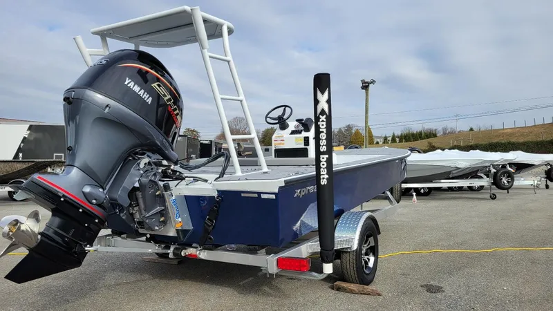 Slide: The Image of 2025 Xpress Skiff 185 with Yamaha Vmax 115 SHO outboard motor on trailer. - 5