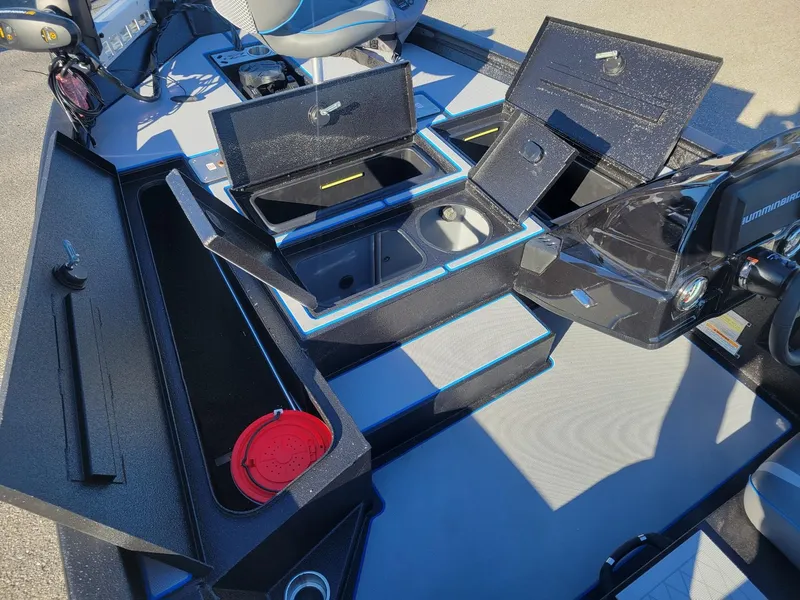 Slide: The Image of 2024 Xpress H18C Crappie Edition boat interior with storage compartments open. - 11