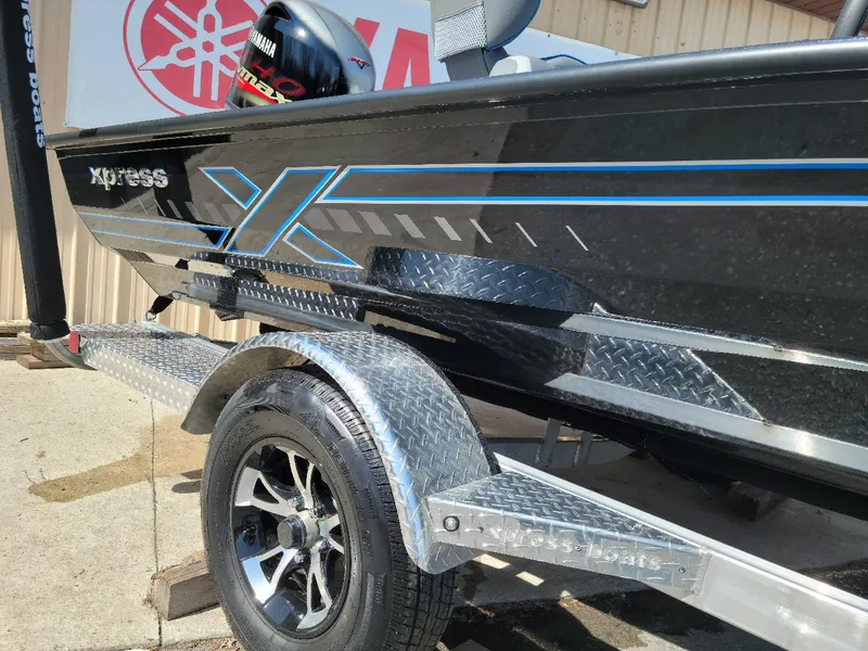 Slide: The Image of 2024 Xpress H18C Crappie Edition boat on a trailer, featuring Yamaha outboard motor. - 6