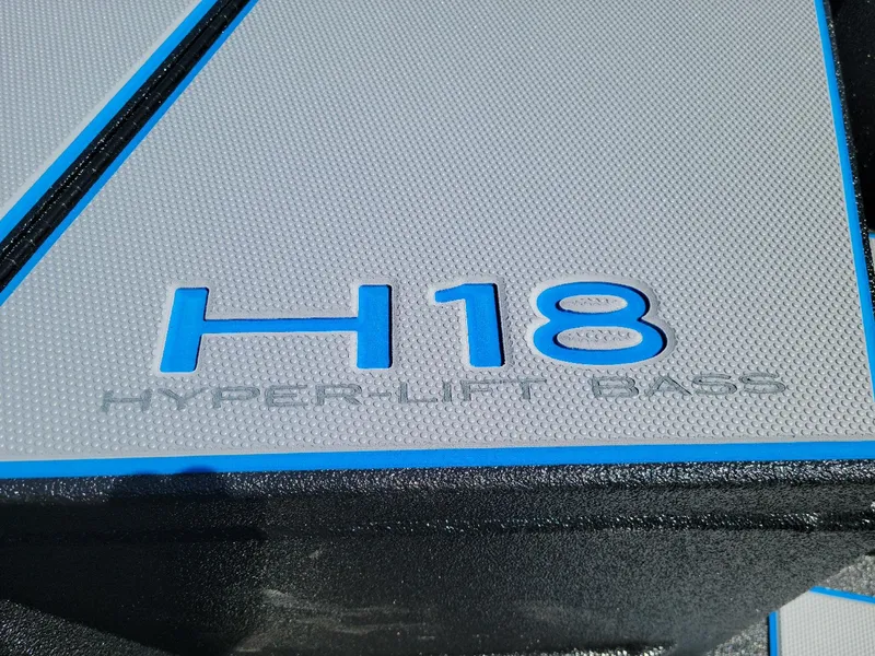 Slide: The Image of 2024 Xpress H18C Crappie Edition boat deck with Hyper-Lift Bass logo. - 8