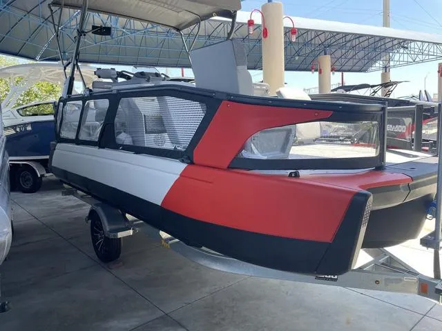 Slide: The Image of 2023 Sea-Doo Switch® Sport 21-230 hp pontoon boat in showroom. - 1