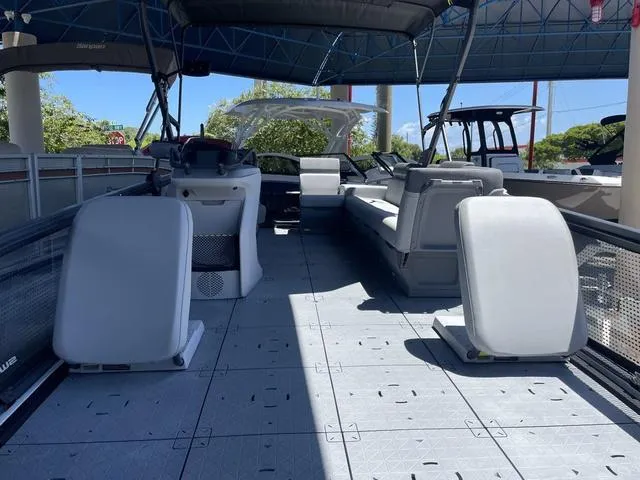 Slide: The Image of 2023 Sea-Doo Switch® Sport 21-230 hp pontoon boat interior with seating and helm. - 10