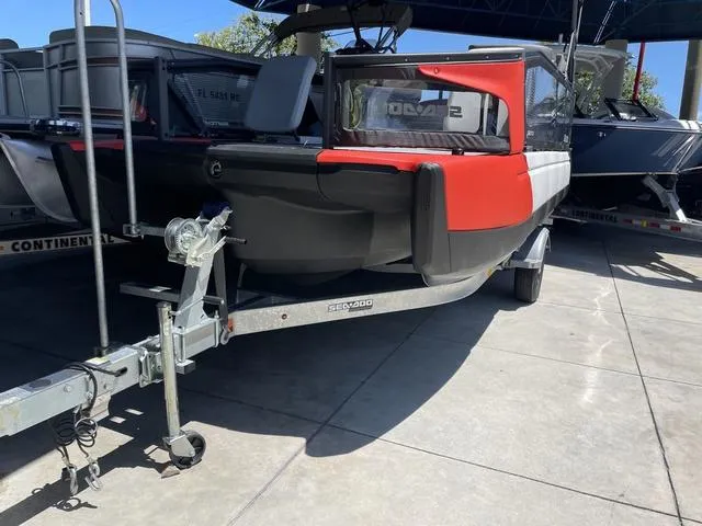 Slide: The Image of 2023 Sea-Doo Switch® Sport 21-230 hp on a trailer in a showroom. - 11