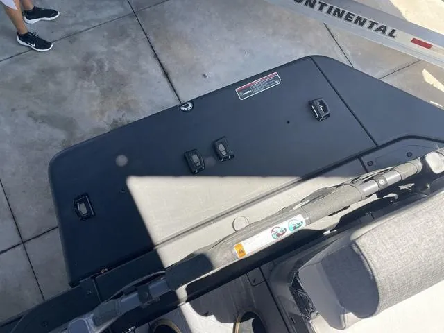 Slide: The Image of 2023 Sea-Doo Switch® Sport 21-230 hp deck view with trailer in background. - 9