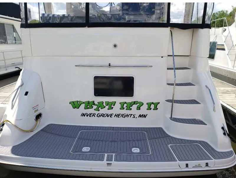 Slide: The Image of 1998 Sea Ray 420 Aft Cabin yacht docked, featuring "What If? II" name and Inver Grove Heights, MN location. - 10