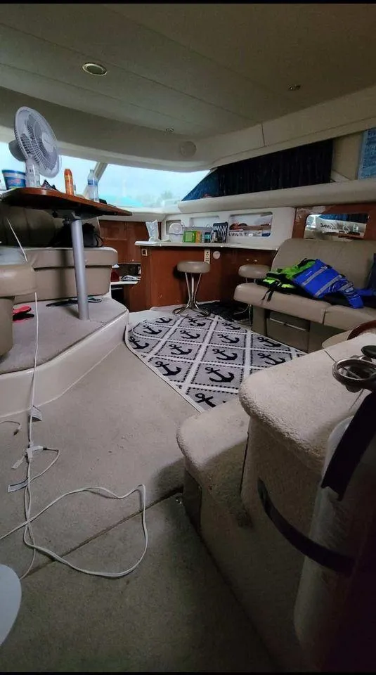 Slide: The Image of Interior of 1998 Sea Ray 420 Aft Cabin yacht with seating and nautical decor. - 11