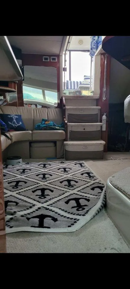 Slide: The Image of Interior of 1998 Sea Ray 420 Aft Cabin with nautical-themed decor. - 4