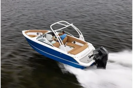 Slide: The Image of 2024 Four Winns H1 OB boat cruising on water. - 11