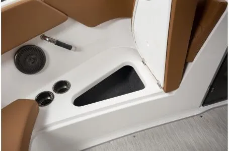Slide: The Image of 2024 Four Winns H1 OB boat interior storage compartment and cup holders. - 12