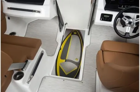 Slide: The Image of 2024 Four Winns H1 OB boat interior with storage compartment and steering wheel. - 13