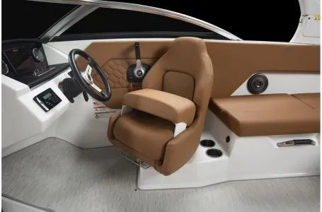Slide: The Image of 2024 Four Winns H1 OB boat interior with brown seating and modern dashboard. - 16
