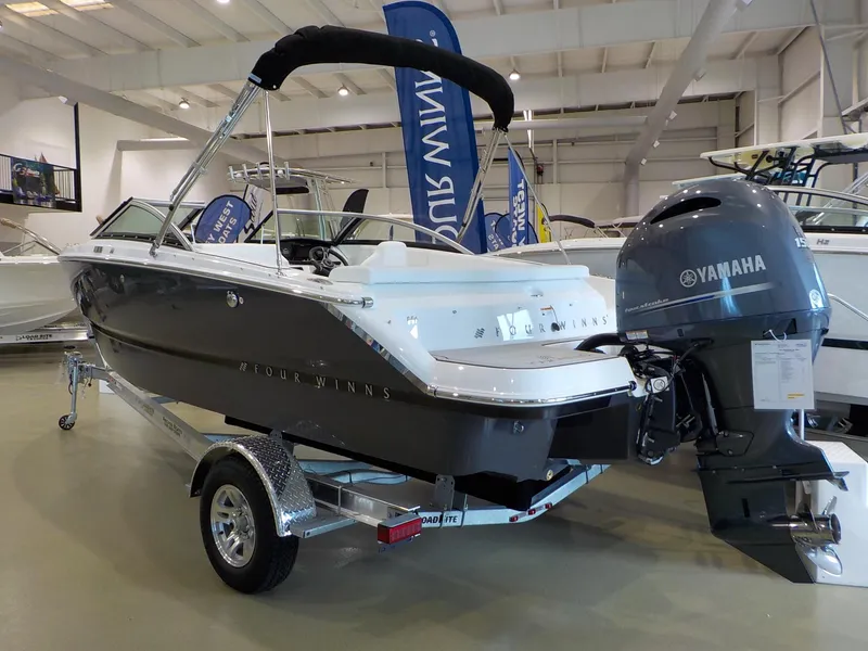 Slide: The Image of 2024 Four Winns H1 OB boat with Yamaha outboard motor on display. - 18