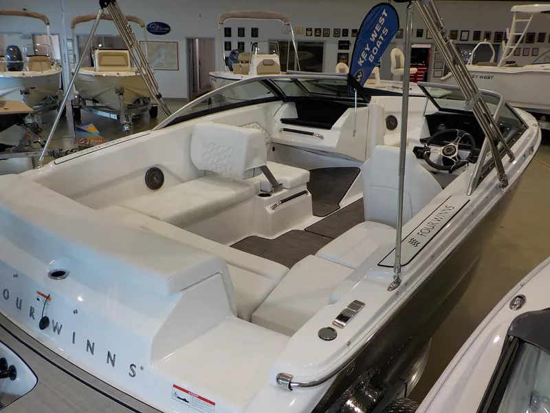 Slide: The Image of 2024 Four Winns H1 OB boat interior with white seating and modern design. - 19