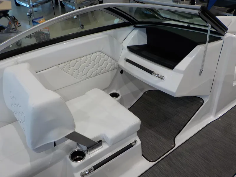 Slide: The Image of 2024 Four Winns H1 OB boat interior with white seating and modern design. - 34