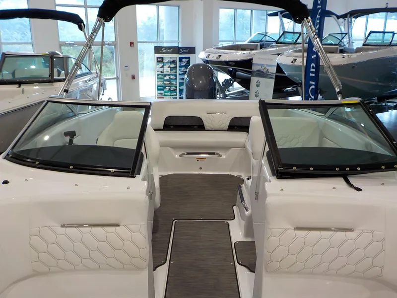 Slide: The Image of 2024 Four Winns H1 OB boat interior with white seating and modern design. - 37
