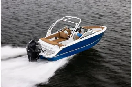 Slide: The Image of 2024 Four Winns H1 OB boat speeding on water. - 6