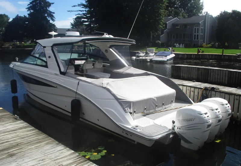 The Image of 2021 Sea Ray 400 SLX Outboard docked at a marina. - 0