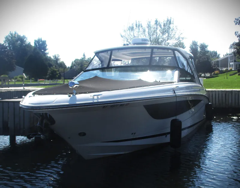 Slide: The Image of 2021 Sea Ray 400 SLX Outboard boat docked in a marina. - 22
