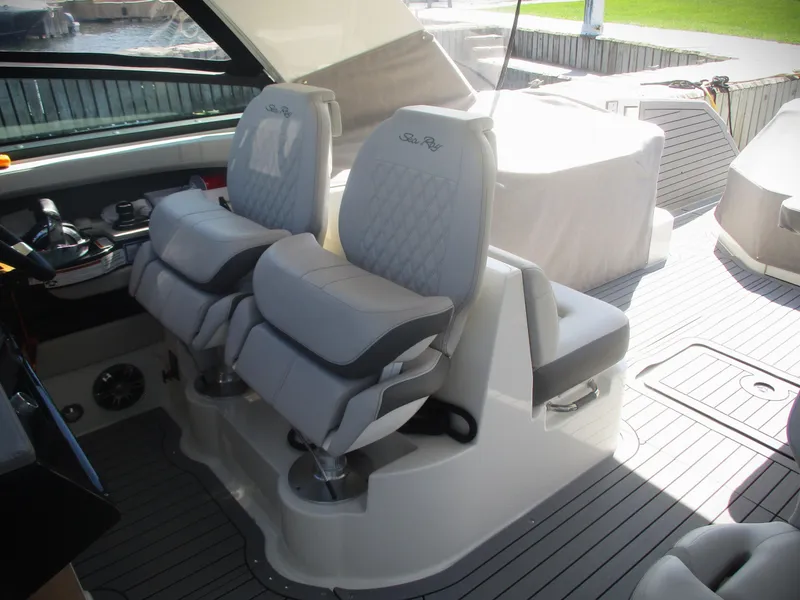 Slide: The Image of 2021 Sea Ray 400 SLX Outboard cockpit with luxurious seating and modern controls. - 31