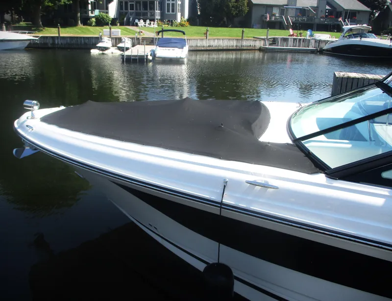 Slide: The Image of 2021 Sea Ray 400 SLX Outboard boat docked in a marina. - 37