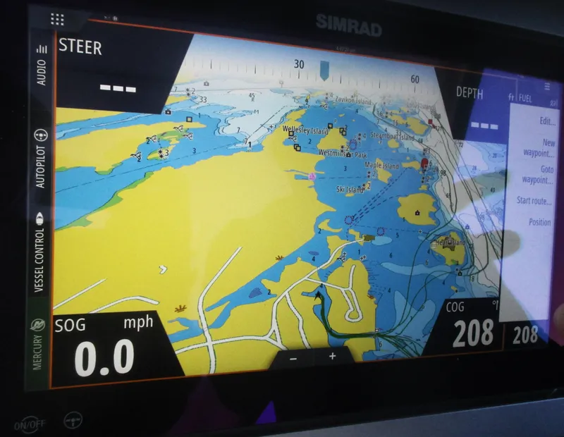 Slide: The Image of Simrad navigation display on 2021 Sea Ray 400 SLX Outboard showing nautical chart. - 47