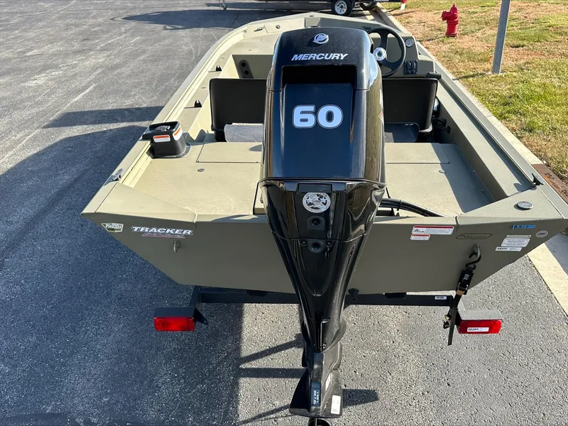 Slide: The Image of 2024 Tracker Grizzly 1754 SC boat with Mercury 60 outboard motor, rear view. - 3