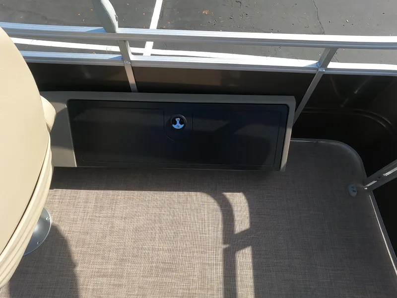 Slide: The Image of 2024 Sun Tracker Sportfish 24 XP3 deck with storage compartment. - 13