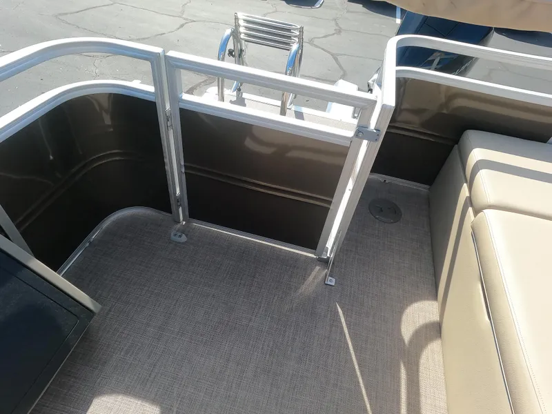 Slide: The Image of 2024 Sun Tracker Sportfish 24 XP3 boat interior with seating and gate. - 15