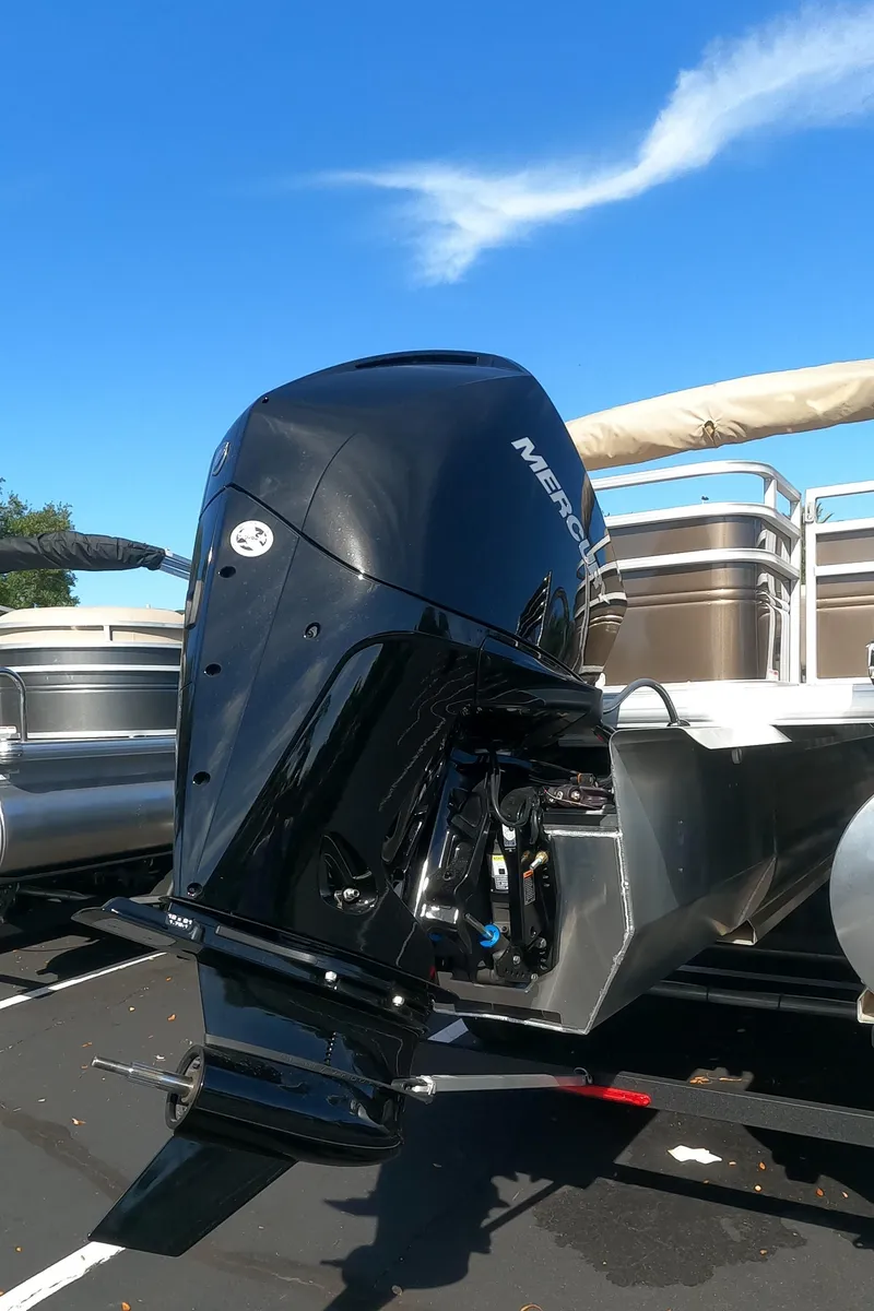 Slide: The Image of 2024 Sun Tracker Sportfish 24 XP3 pontoon boat with Mercury outboard motor. - 17