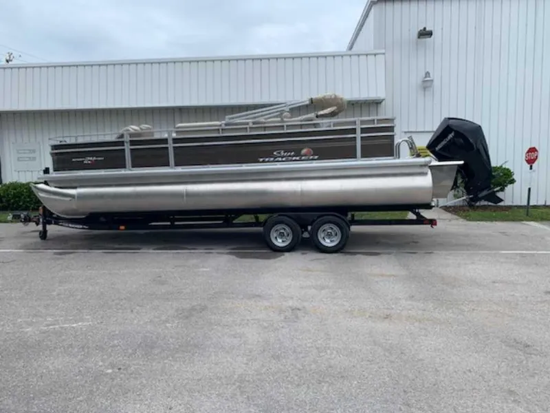 Slide: The Image of 2024 Sun Tracker Sportfish 24 XP3 pontoon boat on a trailer. - 3