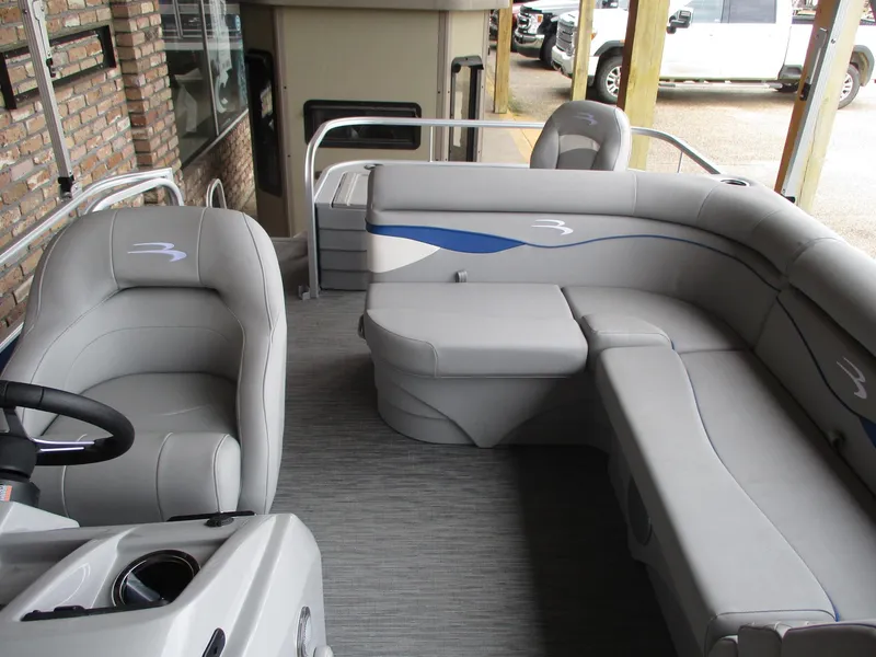 Slide: The Image of 2024 Bennington 18 SF pontoon boat interior with gray seating and blue accents. - 3