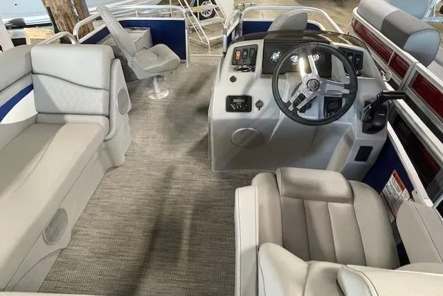 Slide: The Image of 2024 Bennington 18 SF boat interior with plush seating and modern steering console. - 7