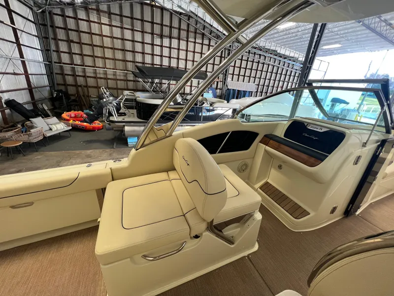 Slide: The Image of Luxurious seating on 2026 Chris-Craft Calypso 28 boat with integrated speakers. - 23