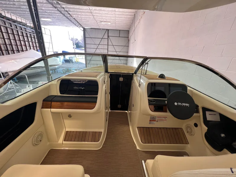 Slide: The Image of Control panel of 2026 Chris-Craft Calypso 28 boat, featuring switches and dials. - 28