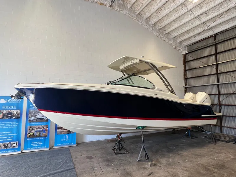 Slide: The Image of 2026 Chris-Craft Calypso 28 boat interior with sleek counter and storage. - 6