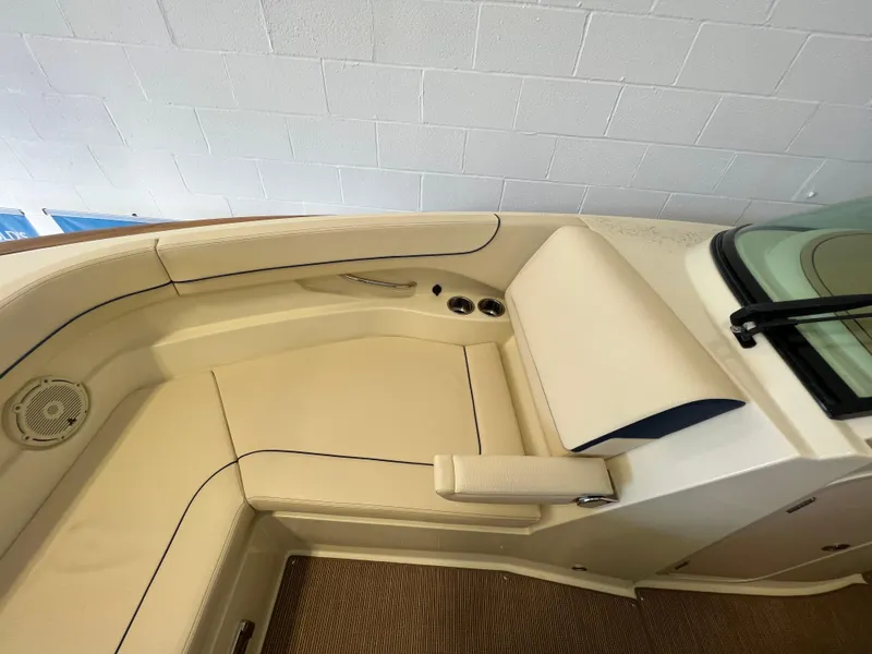 Slide: The Image of 2026 Chris-Craft Calypso 28 boat interior with elegant seating and wooden accents. - 9