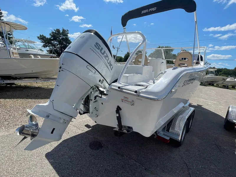 Slide: The Image of 2024 Sea Pro 240 DC Sport boat with Suzuki outboard motor. - 2