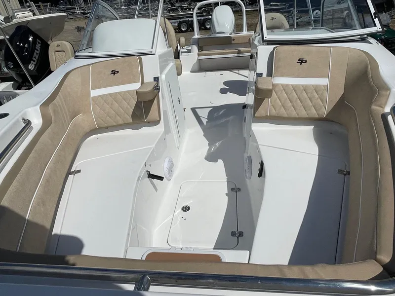 Slide: The Image of 2024 Sea Pro 240 DC Sport boat interior with beige seating and white deck. - 5