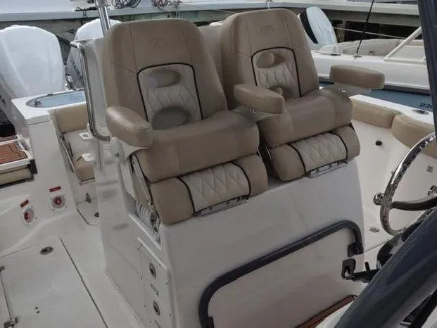Slide: The Image of 2017 Sea Fox 288 Commander boat with dual cushioned seats and armrests. - 12