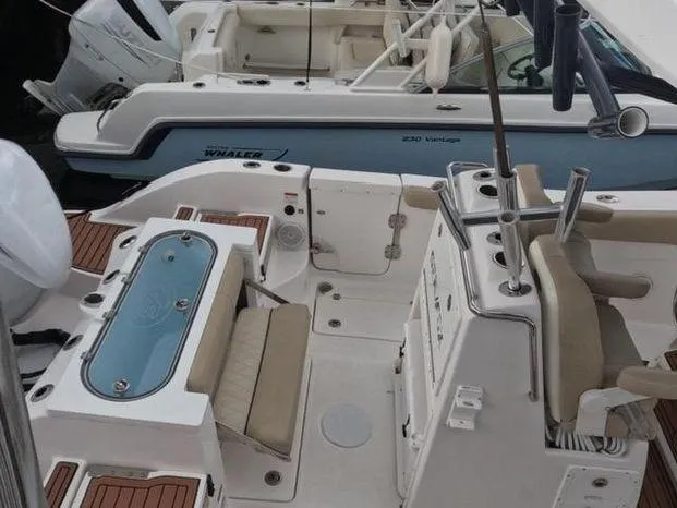 Slide: The Image of 2017 Sea Fox 288 Commander boat interior with seating and fishing equipment. - 14