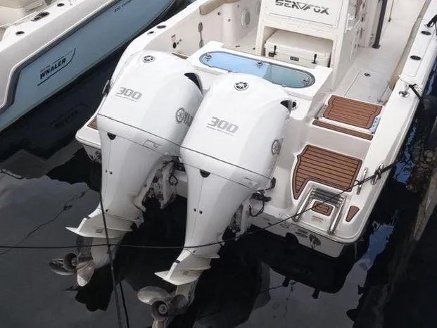 Slide: The Image of 2017 Sea Fox 288 Commander boat with twin 300 horsepower engines docked. - 15