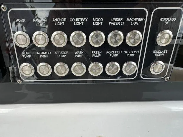Slide: The Image of Control panel of a 2017 Sea Fox 288 Commander boat with labeled buttons. - 23