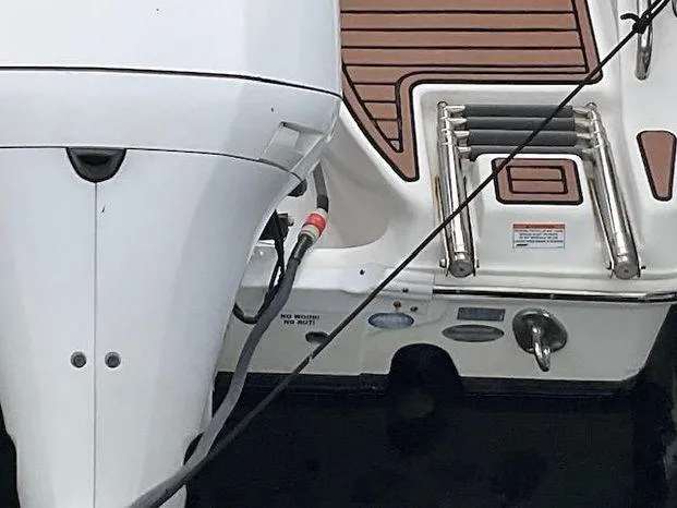 Slide: The Image of 2017 Sea Fox 288 Commander boat stern with motor and swim ladder. - 31