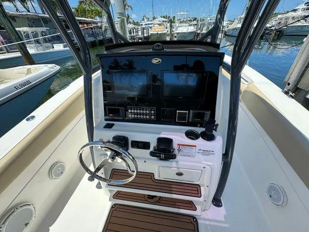 Slide: The Image of 2017 Sea Fox 288 Commander boat console with steering wheel and navigation equipment. - 33