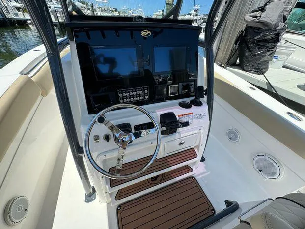 Slide: The Image of 2017 Sea Fox 288 Commander boat helm with steering wheel and control panel. - 34
