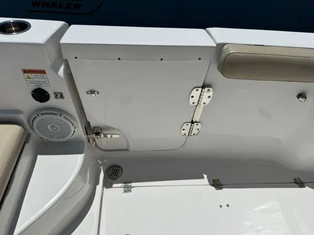 Slide: The Image of 2017 Sea Fox 288 Commander boat interior, featuring seating, speaker, and storage compartment. - 41