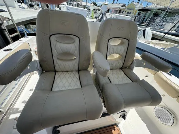 Slide: The Image of Luxurious seating on 2017 Sea Fox 288 Commander boat, featuring plush, diamond-stitched upholstery. - 45