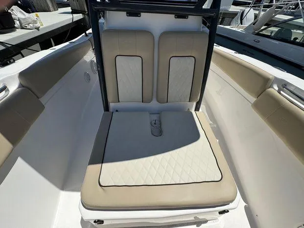 Slide: The Image of 2017 Sea Fox 288 Commander boat seating area with beige cushions. - 48
