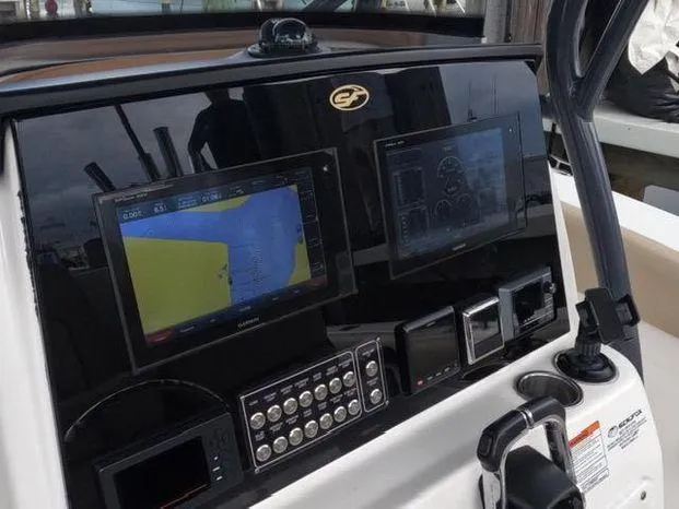 Slide: The Image of 2017 Sea Fox 288 Commander dashboard with dual navigation screens and control panel. - 6